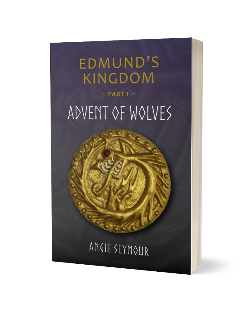 An image of a paperback book standing upright. The cover has the following from top to bottom: A dark blue background. Text: "Edmund's Kingdom Part 1." Title: "Advent of Wolves". Icon: a golden coin with a serpentine dragon curled around itself, with a ruby eye, long white teeth, and a tongue lashing out of its mouth. Author: Angie Seymour.